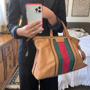 Gucci
Women's Brown Rania Leather Top Handle Bag tassel detail